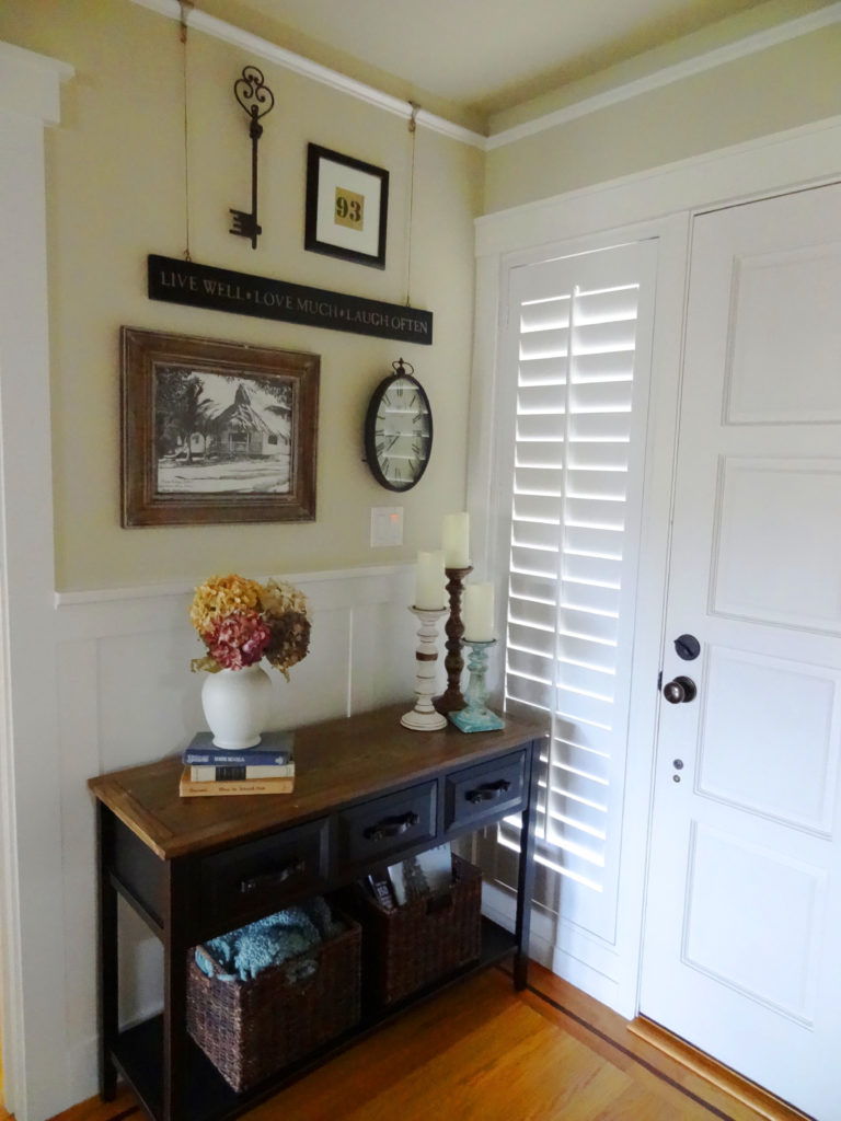 entry makeover with wainscoting and wall art collage
