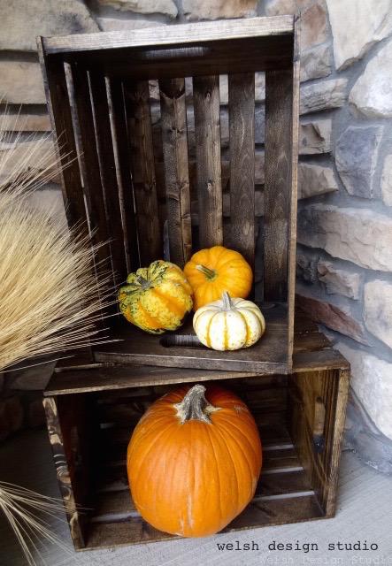 fall decorations stained crates with pumpkins and wheat