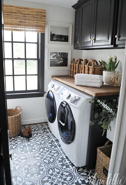 laundry room black cabinets and tile