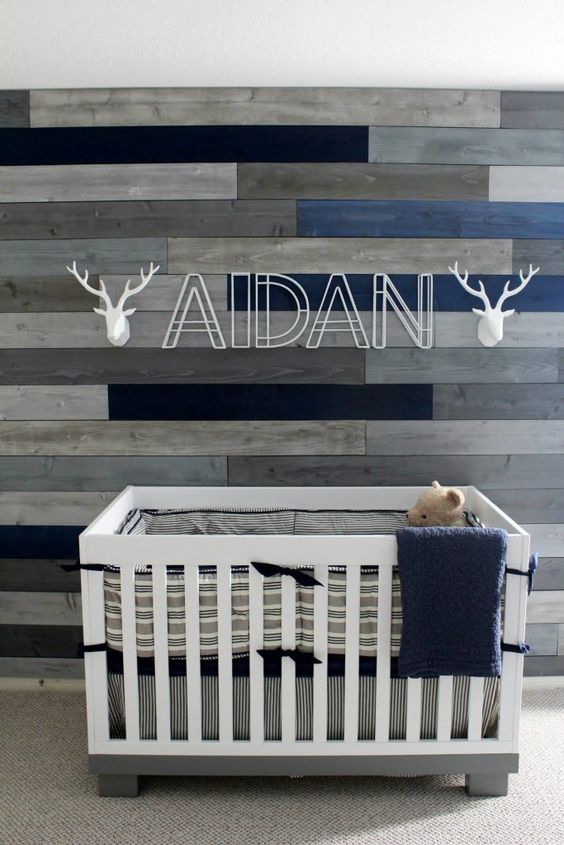 navy and gray nursery with reclaimed wood wall