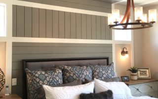 painted shiplap behind bed