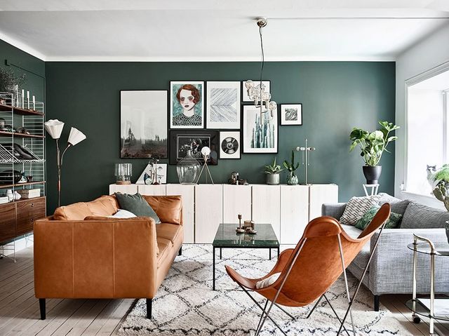 green living room with leather furniture