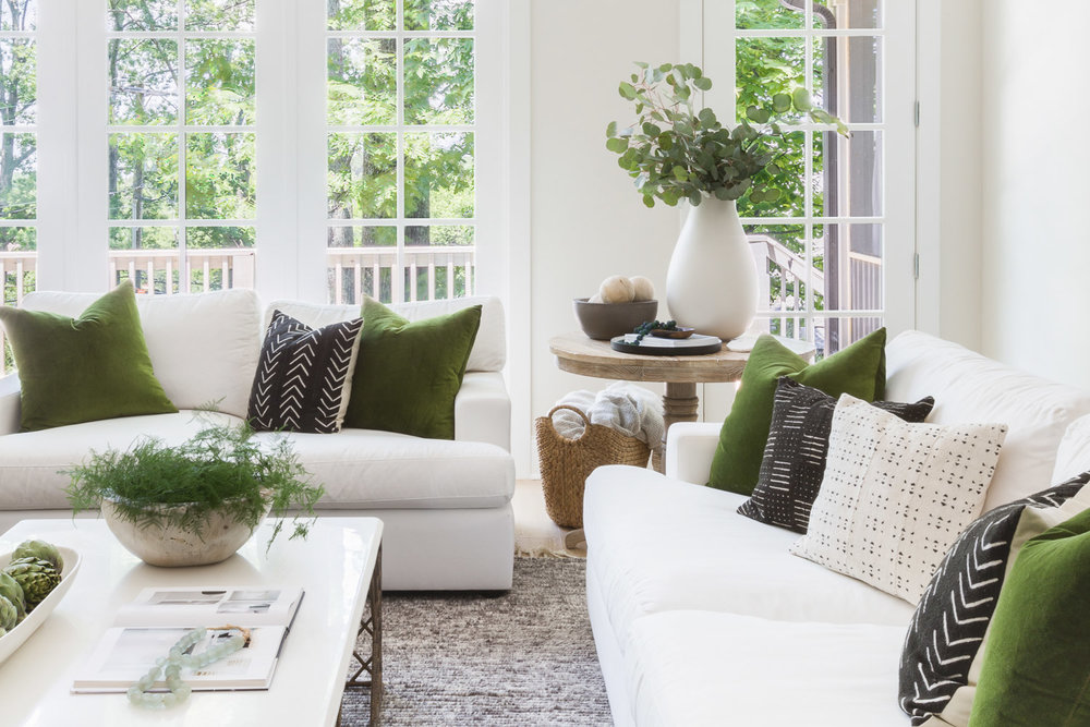 decorating with emerald green pillows in living room on sofa