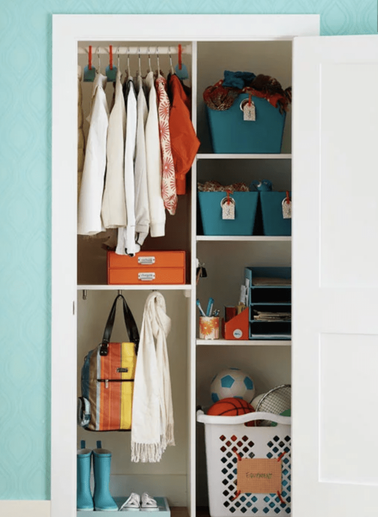 organized coat closet with dividers