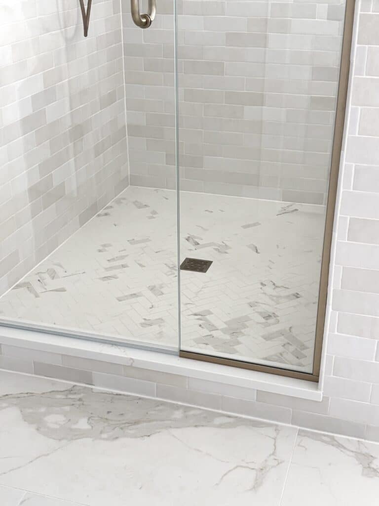 bedrosians calacatta super white herringbone shower floor