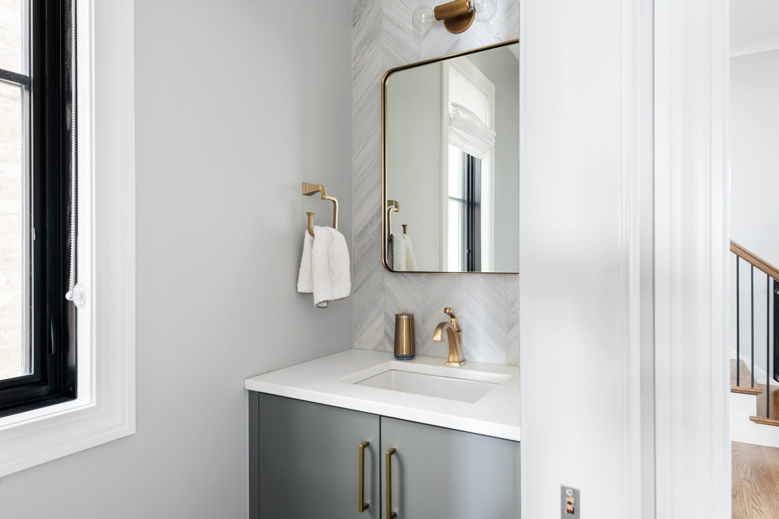 brass hardware with gray cabinets bathroom