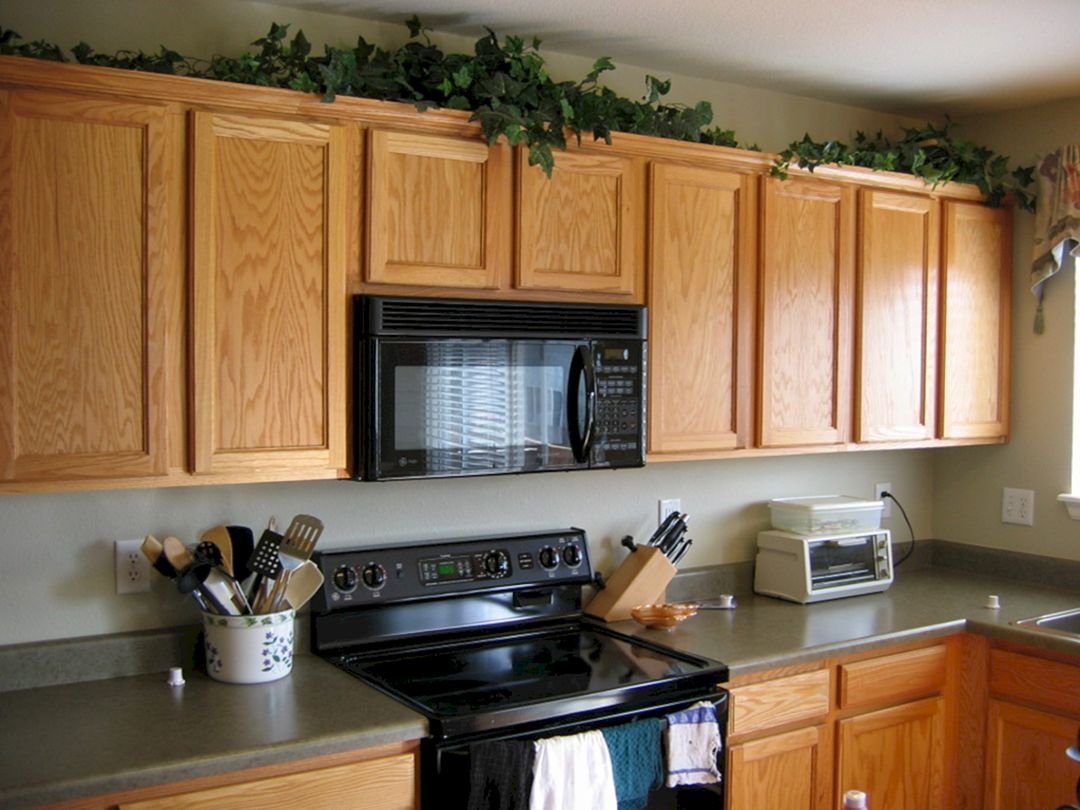 outdated design trends plants on top of kitchen cabinets