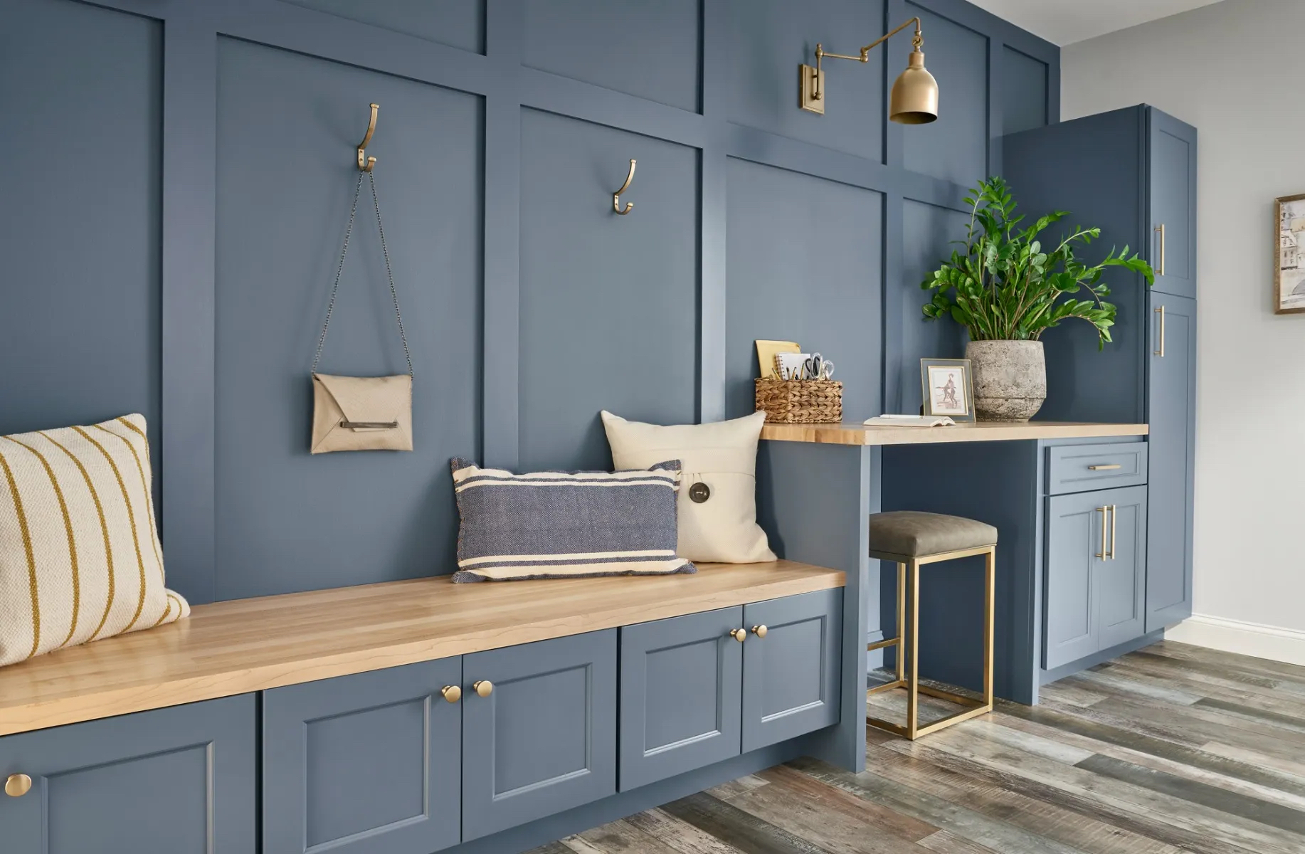 brass fixtures with blue cabinets